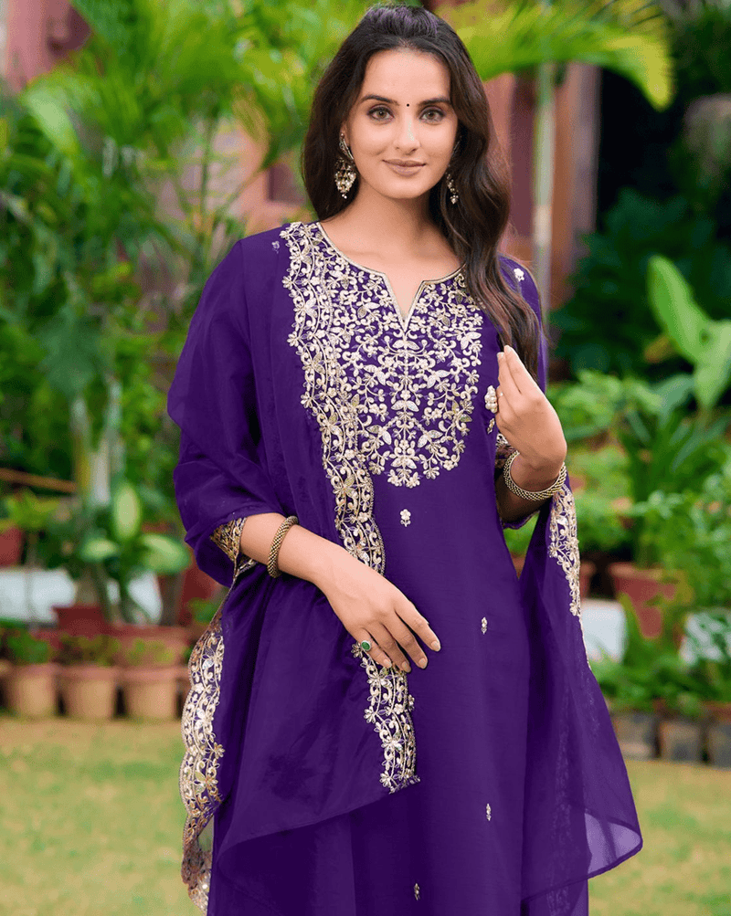 Elegant purple three piece kurta set with intricate embroidery, perfect for festive occasions