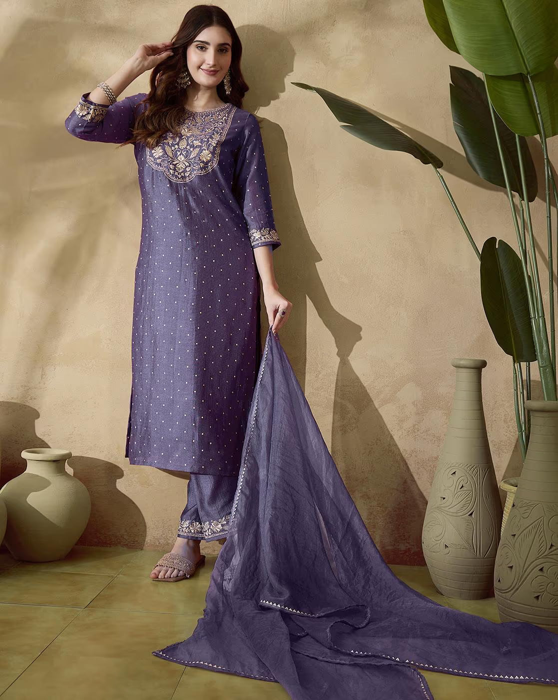 Elegant three piece kurta set in dark purple featuring intricate embroidery, perfect for festive occasions