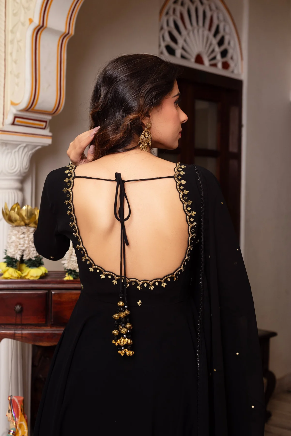 Black hand work anarkali suit featuring intricate detailing on the back for elegant occasions.