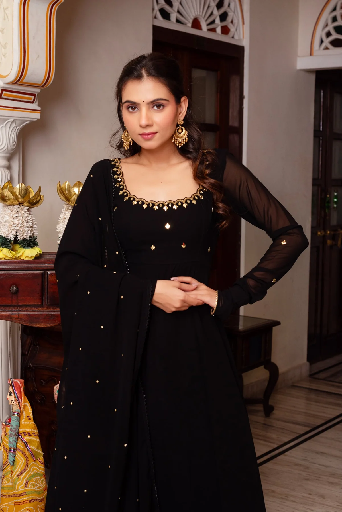 Front view of a black hand work anarkali suit with intricate details, perfect for festive occasions or weddings