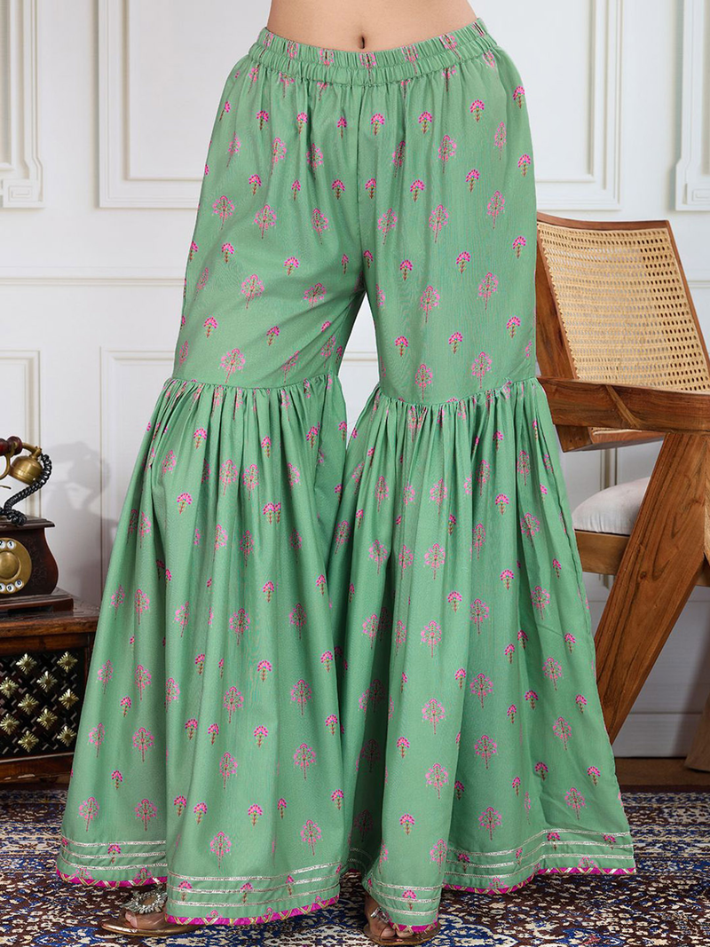 Aromie green printed palazzo pants with colorful floral designs for a stylish look, part of a black printed kurta set.