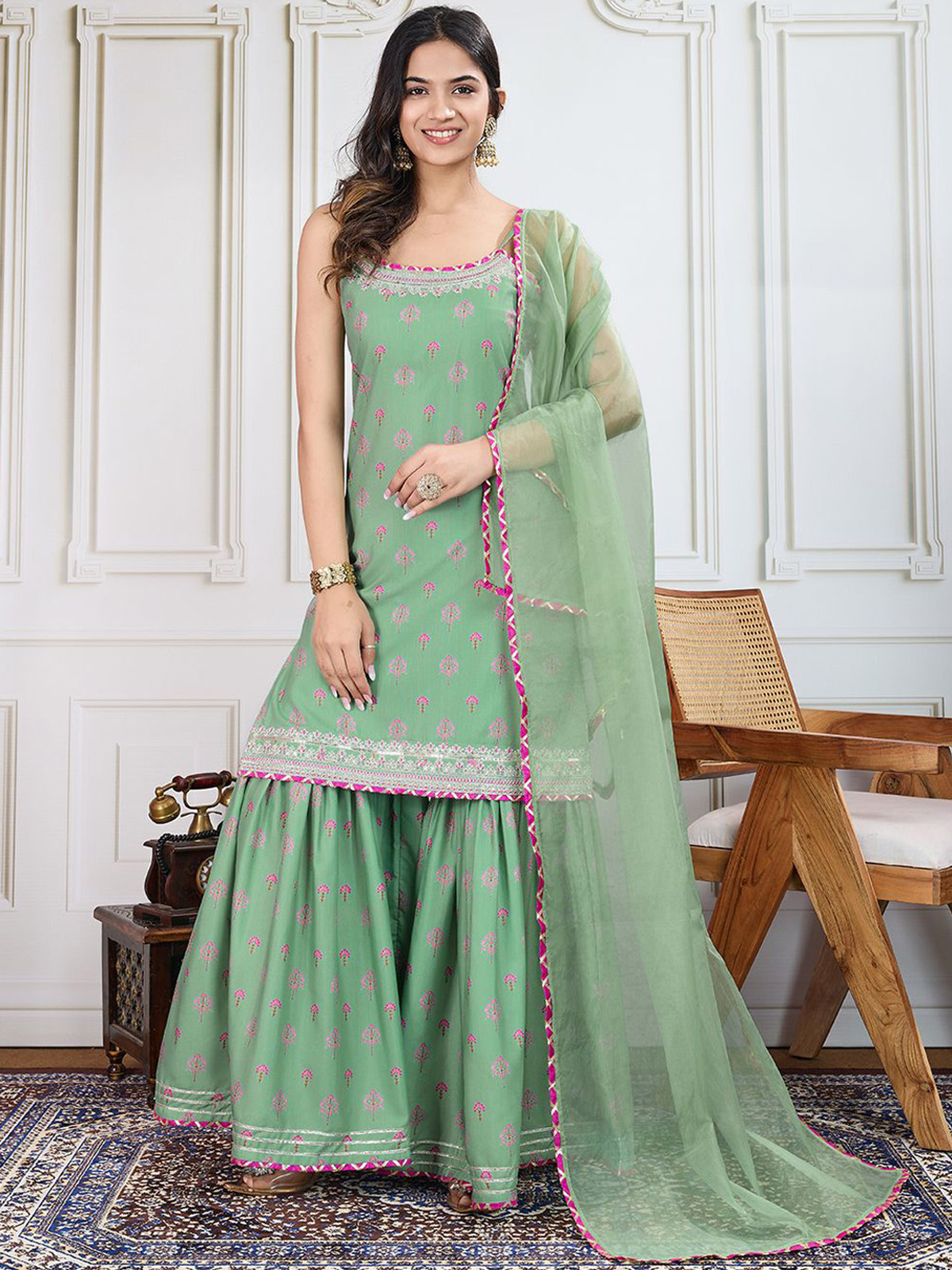 Elegant green three piece Kurtha set with printed design and matching dupatta for festive occasions