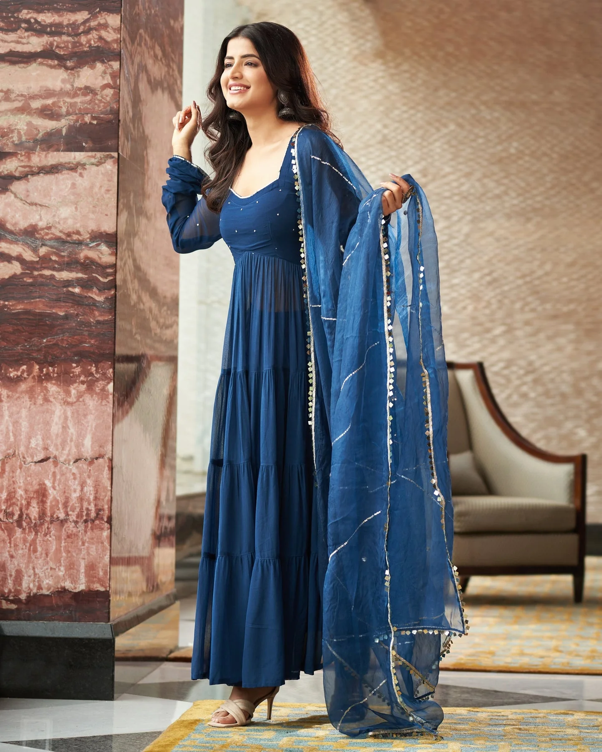 Front view of a blue georgette anarkali suit Canada featuring layered design and embellished details, ideal for festive occasions.
