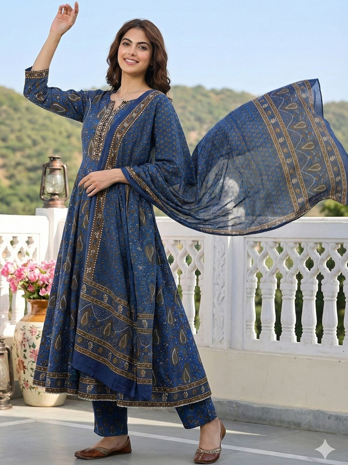 Front view of a blue printed Anarkali kurta set Canada with flowy sleeves, ideal for festive occasions.