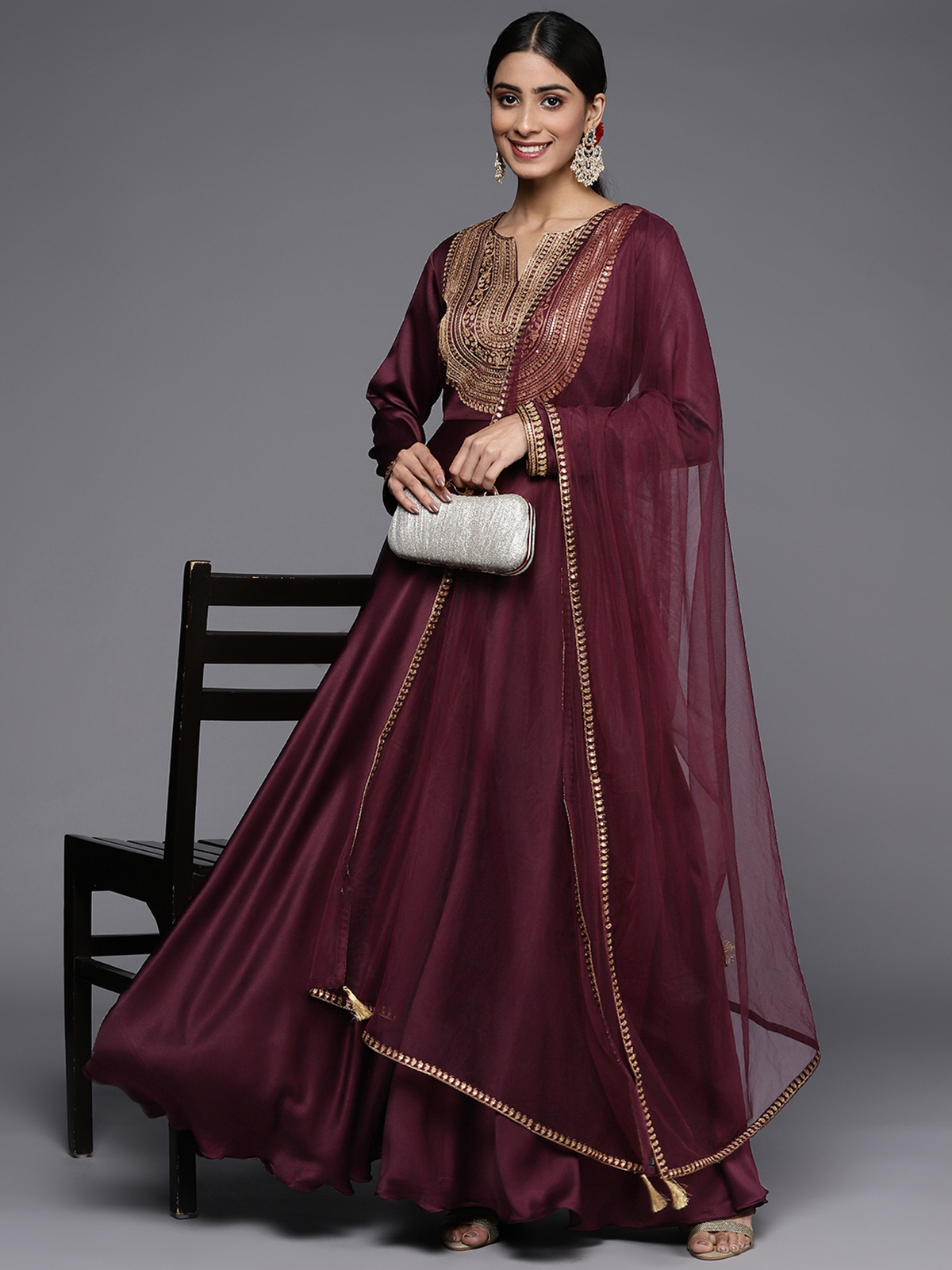 Elegant burgundy satin anarkali kurta with intricate embroidery and flowing sleeves