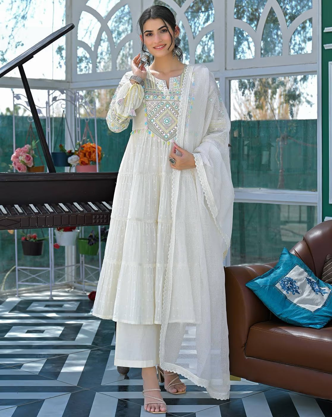 Elegant three piece Kurtha set in white featuring intricate embroidery, perfect for casual wear.