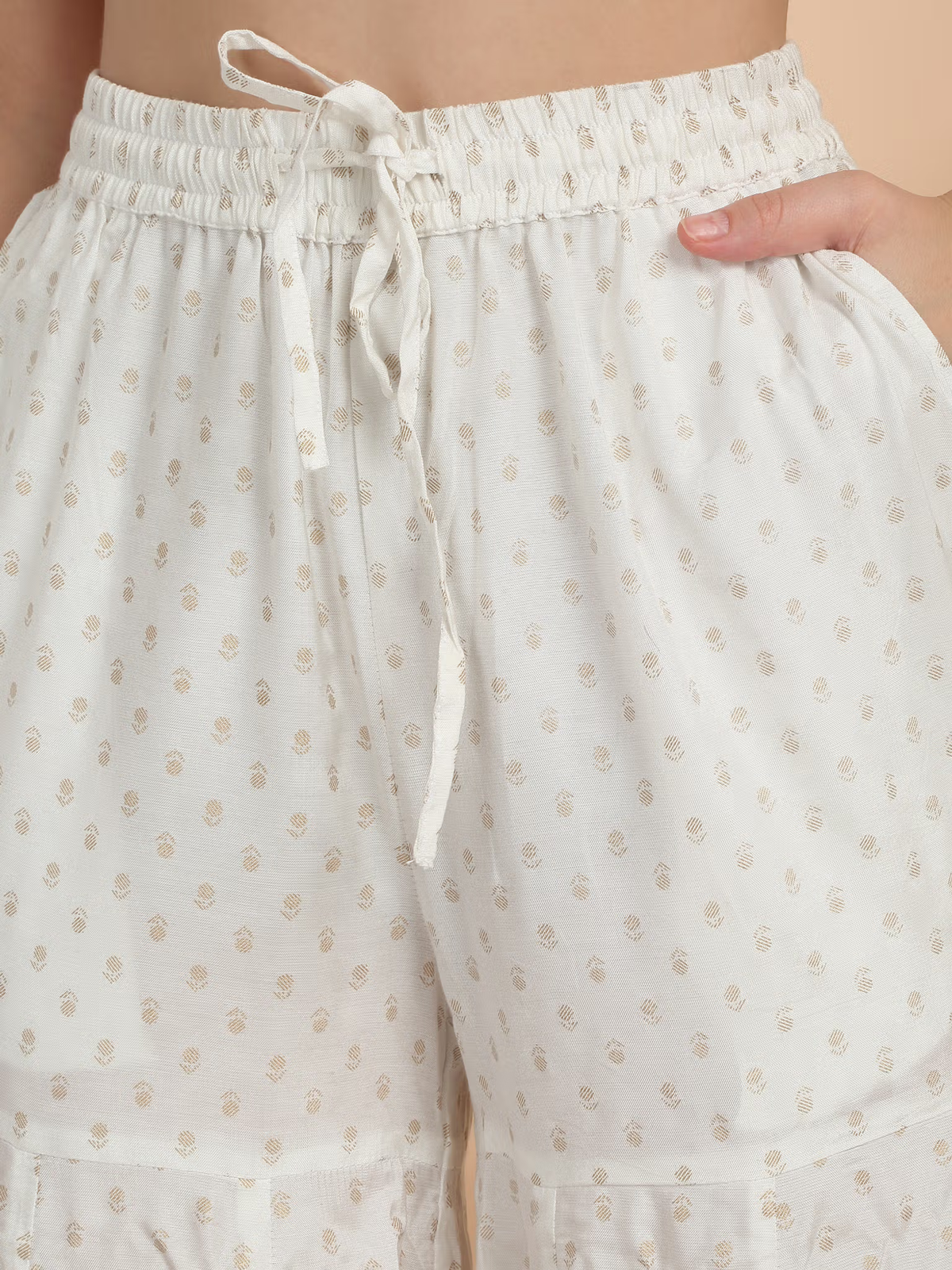 Aromie three piece Kurtha close up white embroidered Anarkali suit Canada drawstring waist pants with gold dot motifs