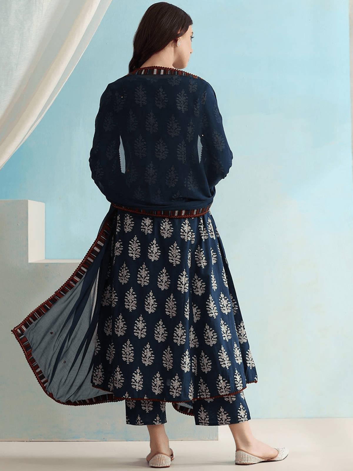 Back view of Cotton Anarkali Kurta Set Canada featuring a navy blue design with leaf patterns and contrasting borders