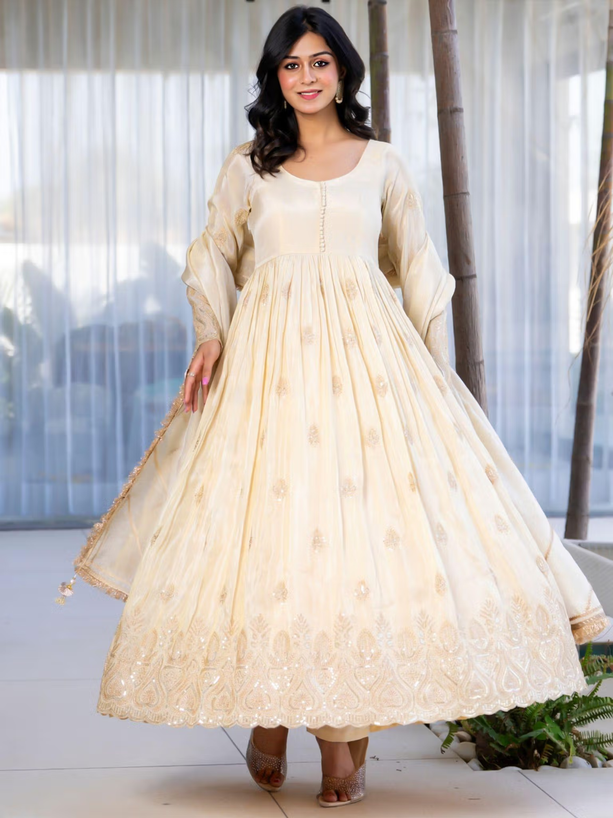 Aromie three piece kurtha cream anarkali with embroidered hem and matching dupatta on model bright red floral co-ord set