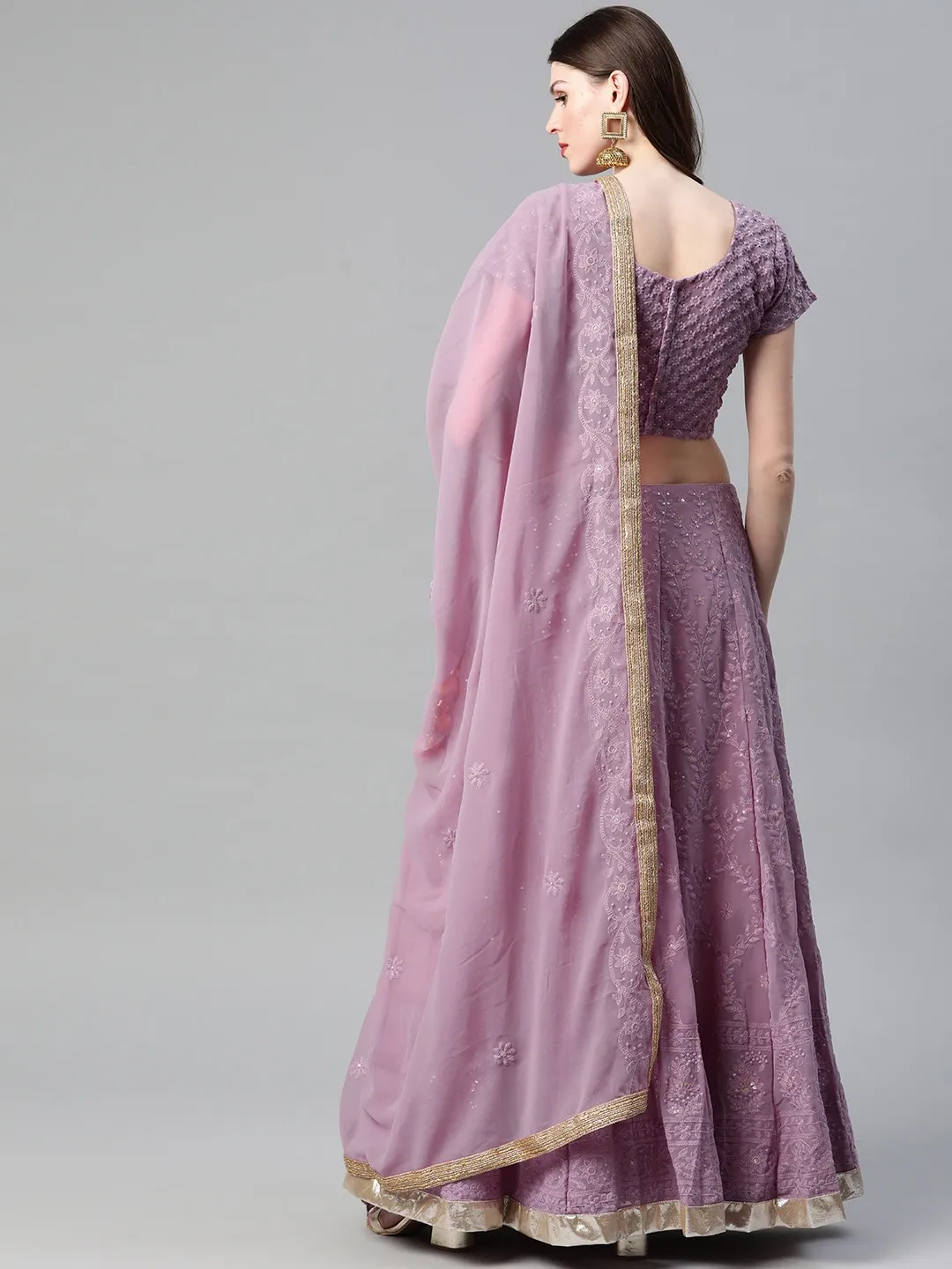 Purple lehenga choli set USA made of embroidered fabric, perfect for weddings and festive occasions