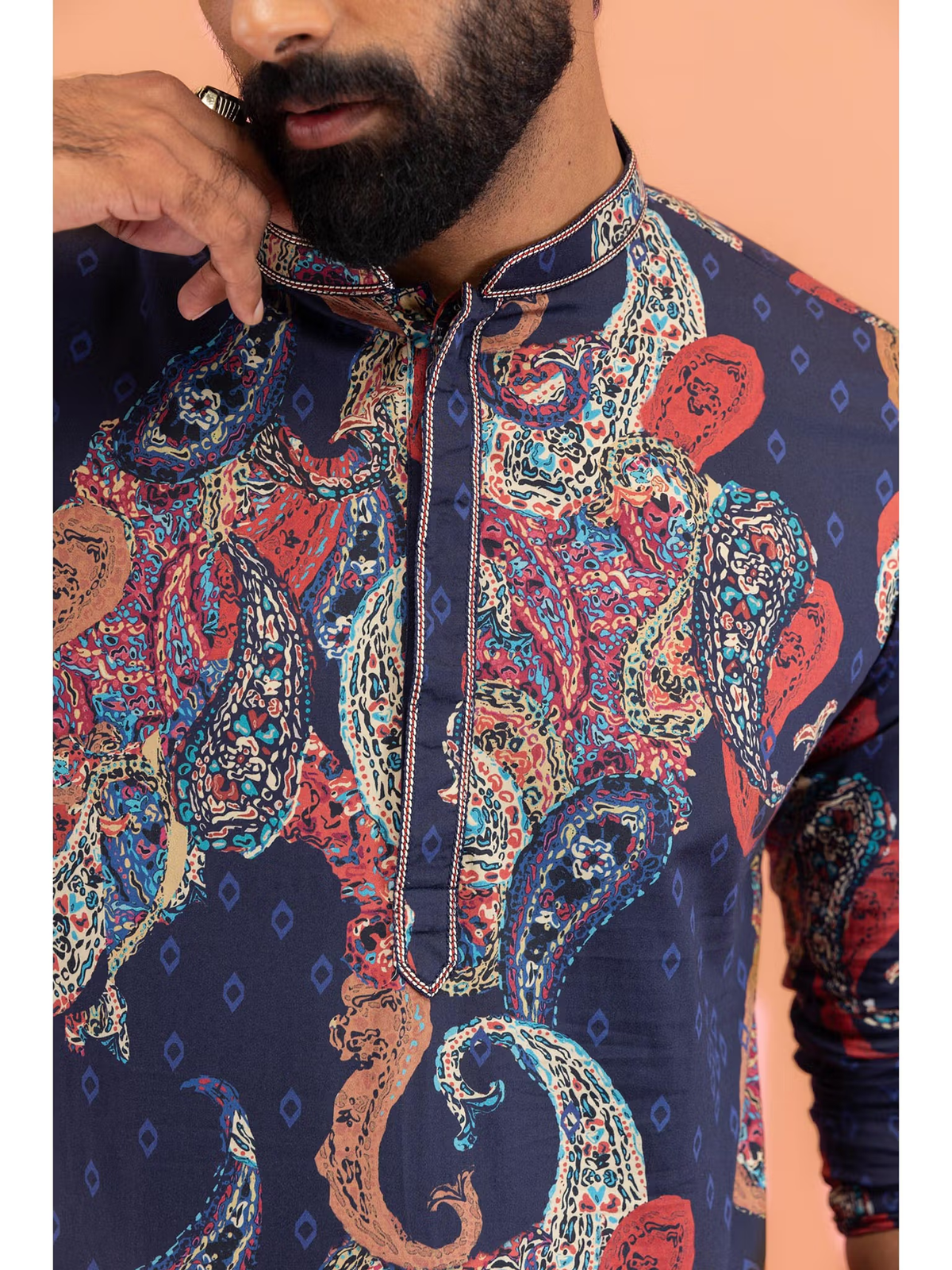 Close up of AROMIE men's black printed kurta Canada with paisley print band collar and long sleeves