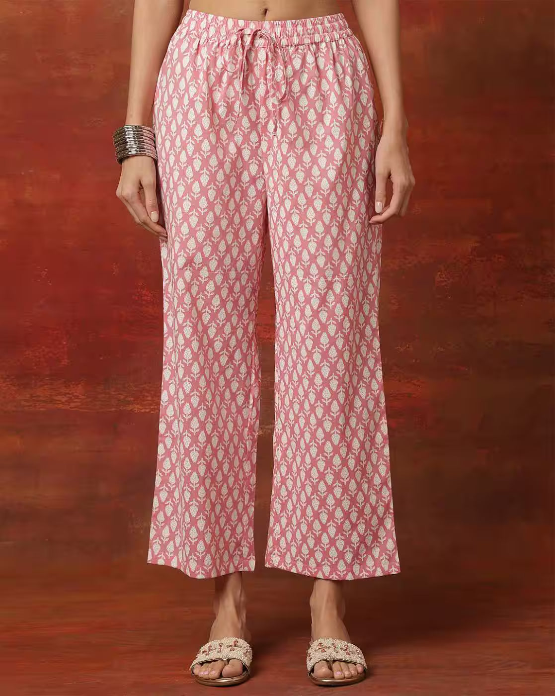 Three piece Kurtha set in pink with geometric print for casual or festive wear, lightweight cotton fabric