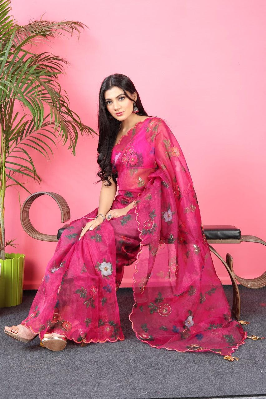 Front view of a pink designer saree in lightweight fabric with floral embellishments, perfect for weddings in Canada.