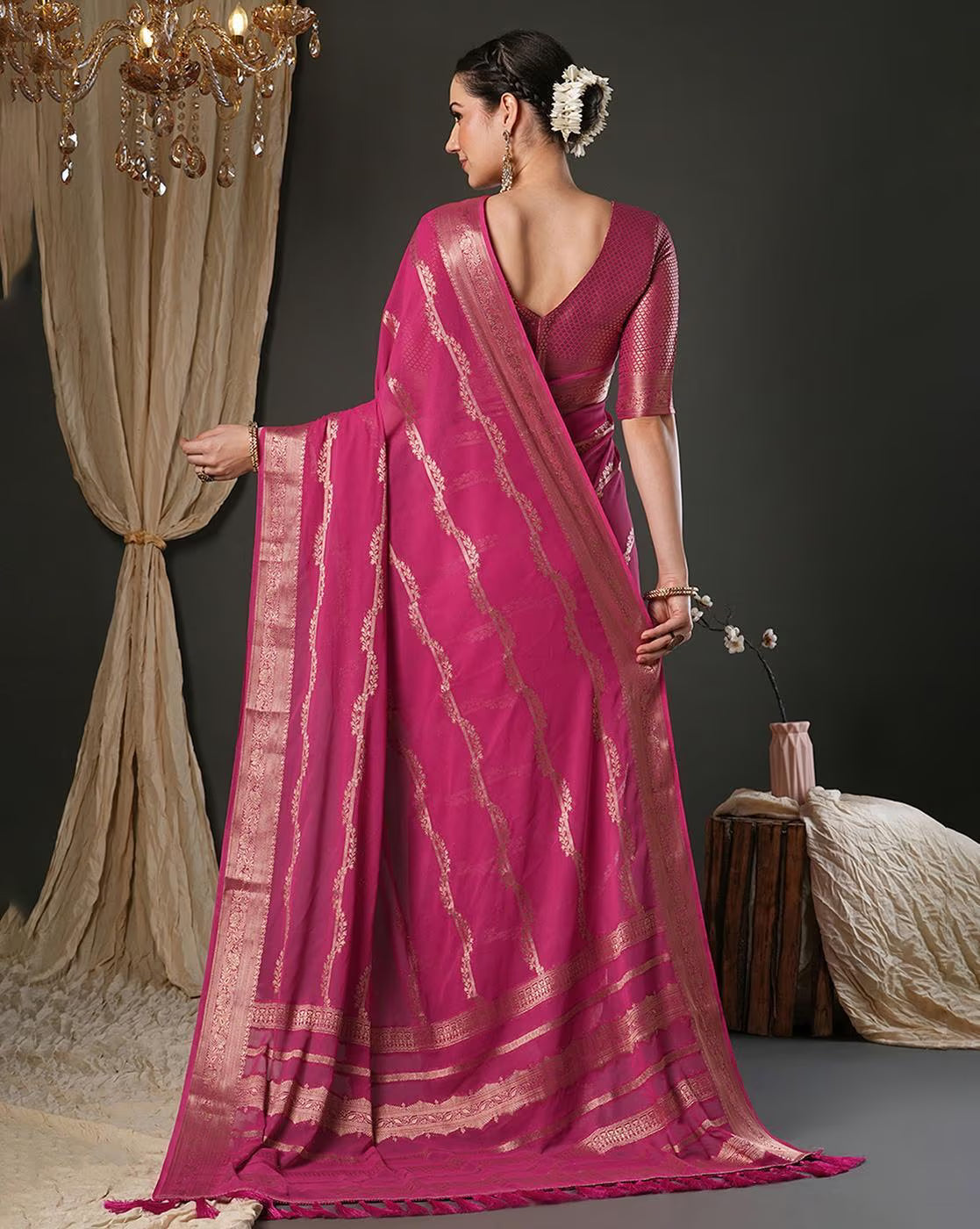 Elegant Designer Tussar Silk Saree in pink with intricate golden border and drape