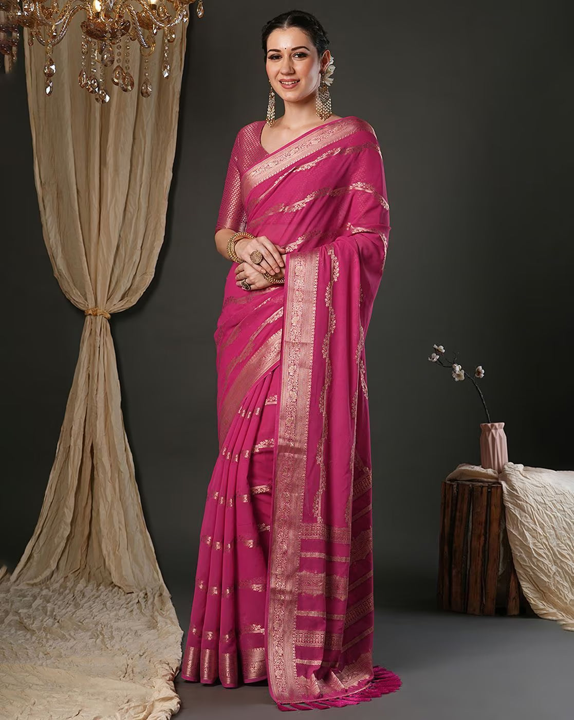 Elegant Designer Tussar Silk Saree in vibrant pink with intricate golden designs and pleats