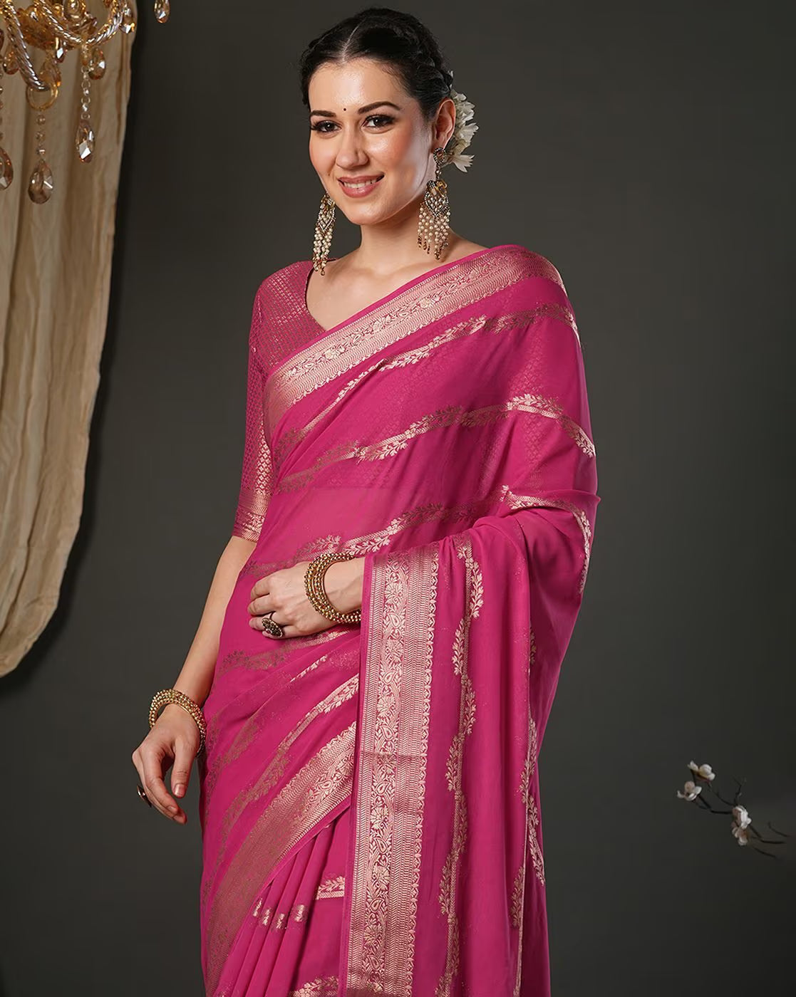Elegant Designer Tussar Silk Saree in pink with intricate golden embroidery and a graceful drape