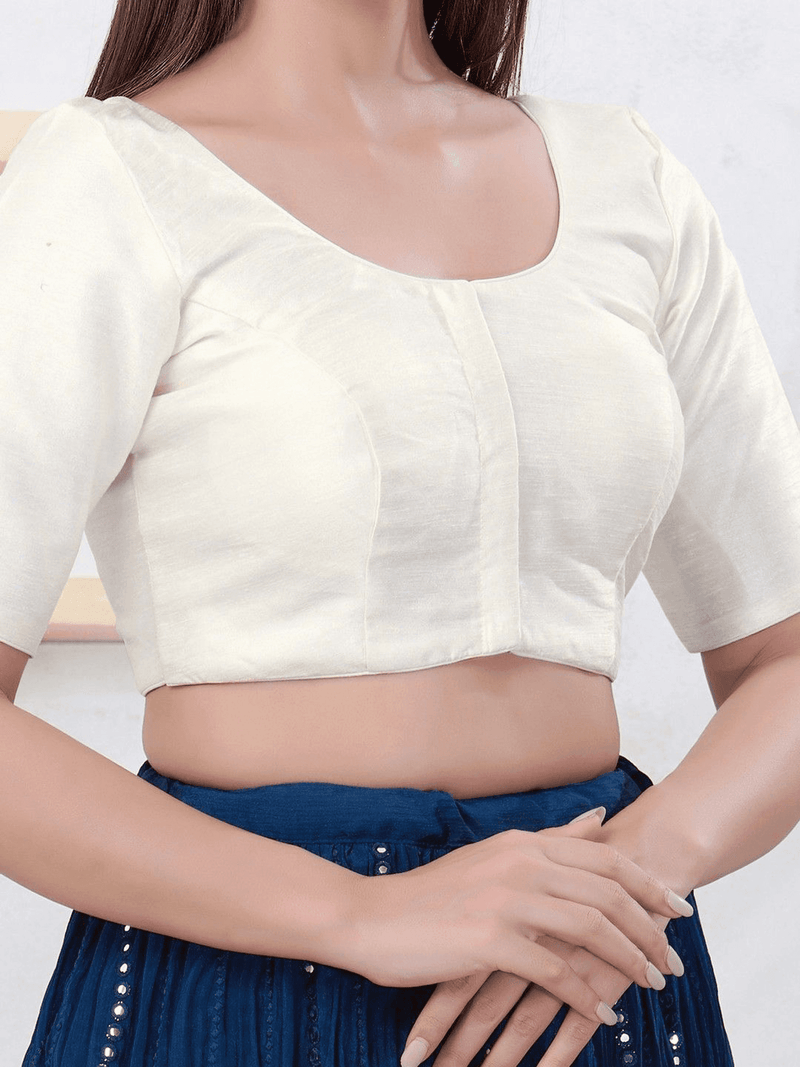 White blouse with blue skirt on a plain background