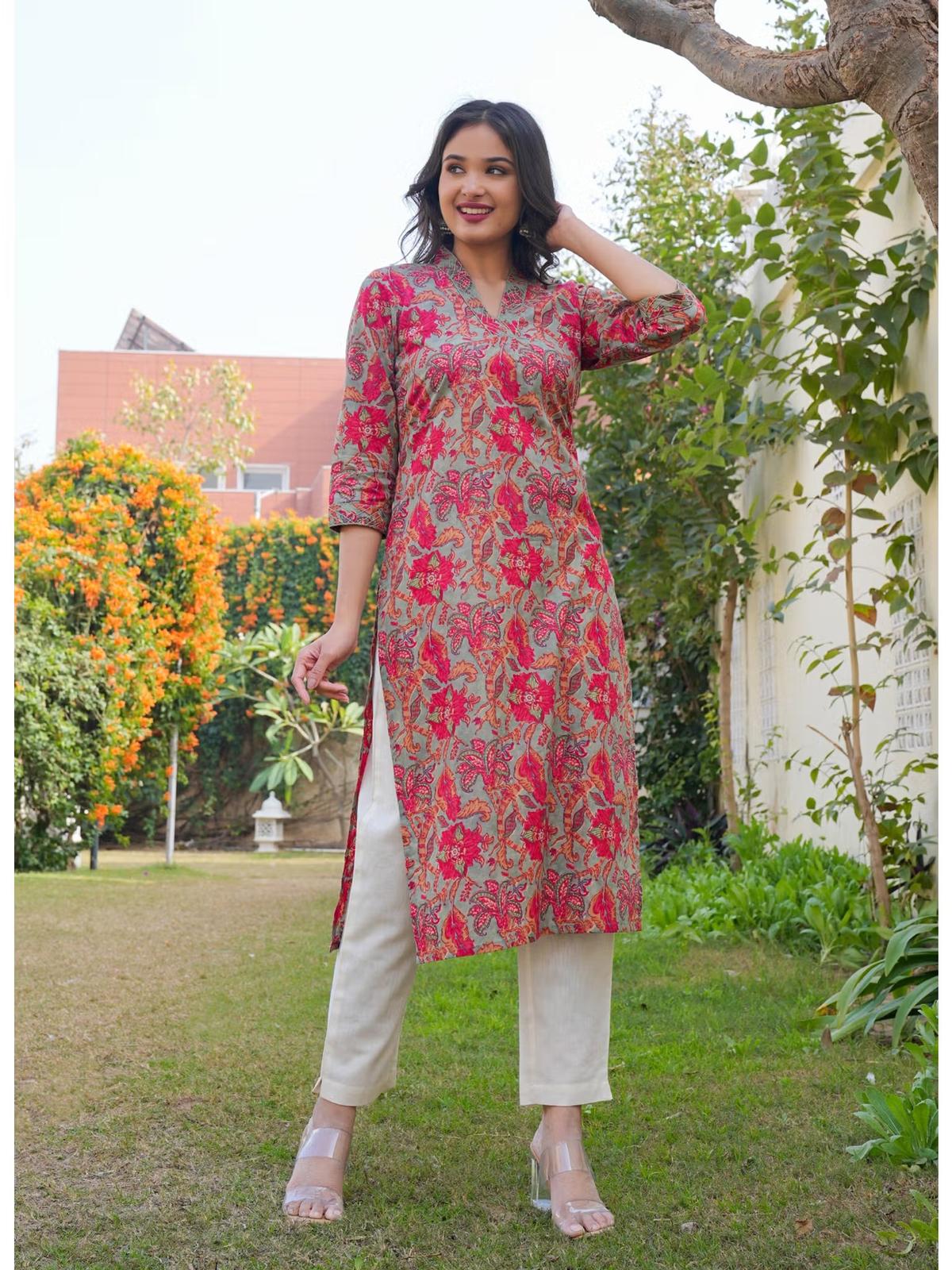 Pink floral kurta with three quarter sleeves and side slits on model Aromie Embroidered jumpsuit for women