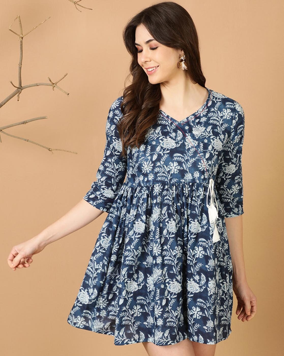 aromie blue floral babydoll tunic with three quarter sleeves and gathered waist model wearing relaxed fit tank top women