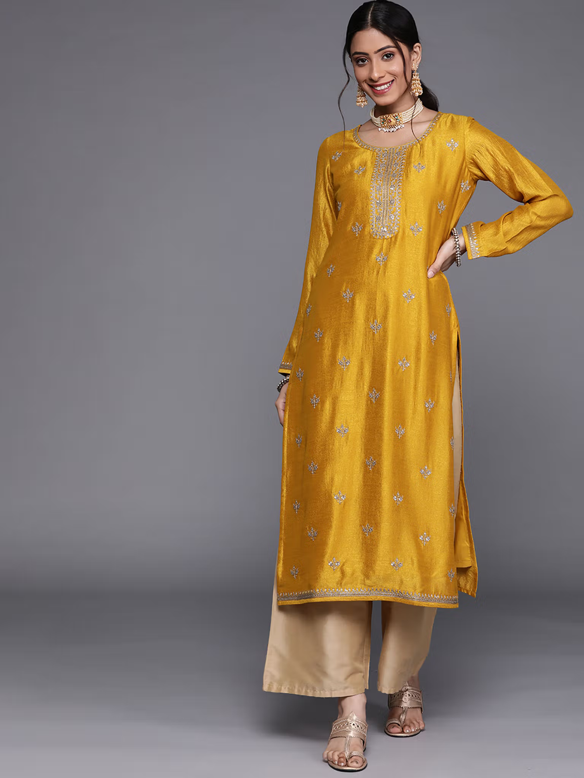 Aromie single piece kurta in mustard color paired with beige pants showcasing eco-friendly palazzo jumpsuit style