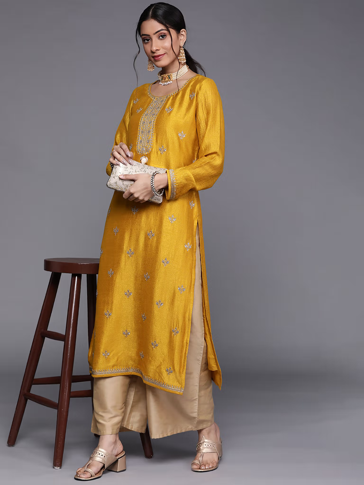 Aromie single piece kurta in mustard yellow with beige palazzo pants styled as eco-friendly palazzo jumpsuit