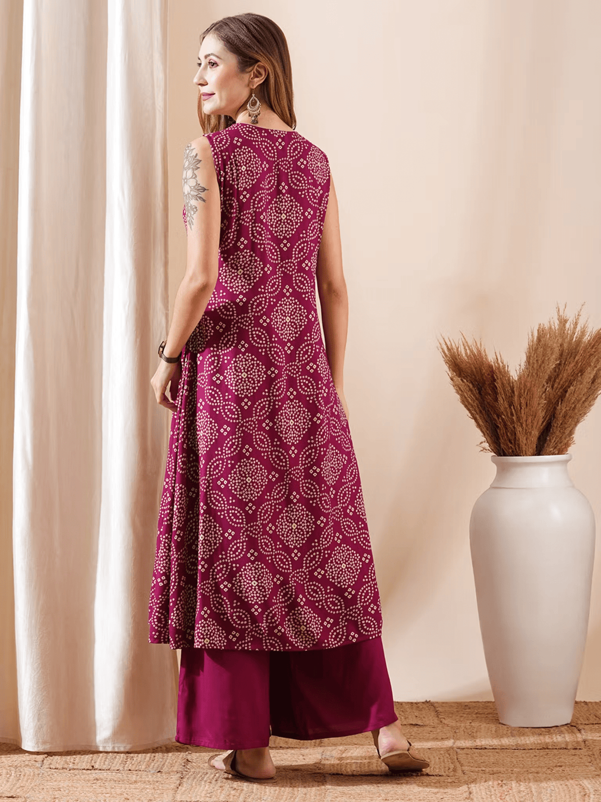 Elegant bandhani kurta set in deep maroon, featuring intricate patterns and a flowing silhouette for stylish comfort