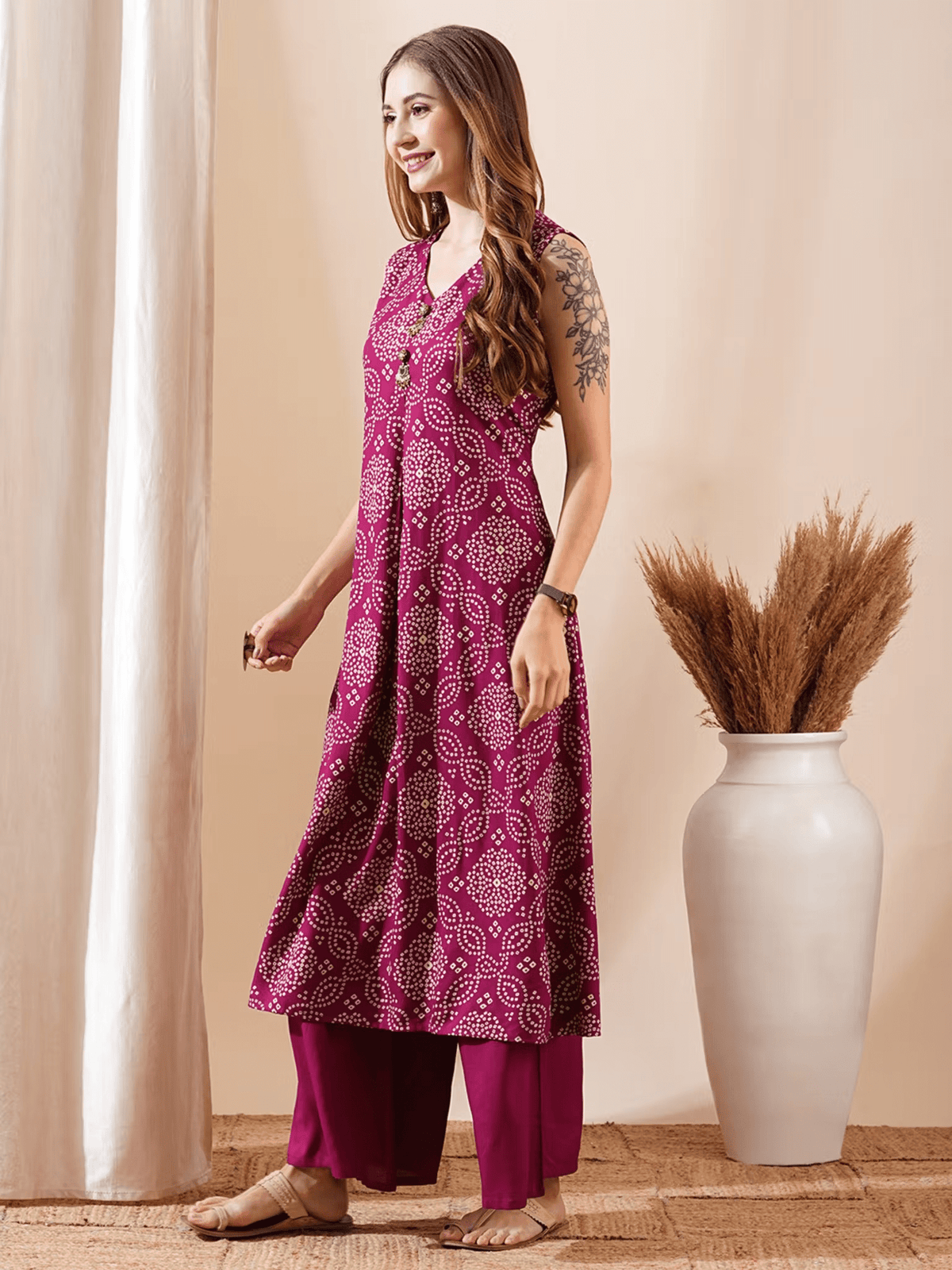 Elegant bandhani kurta set in rich magenta with sleeveless design and palazzo pants for stylish occasions