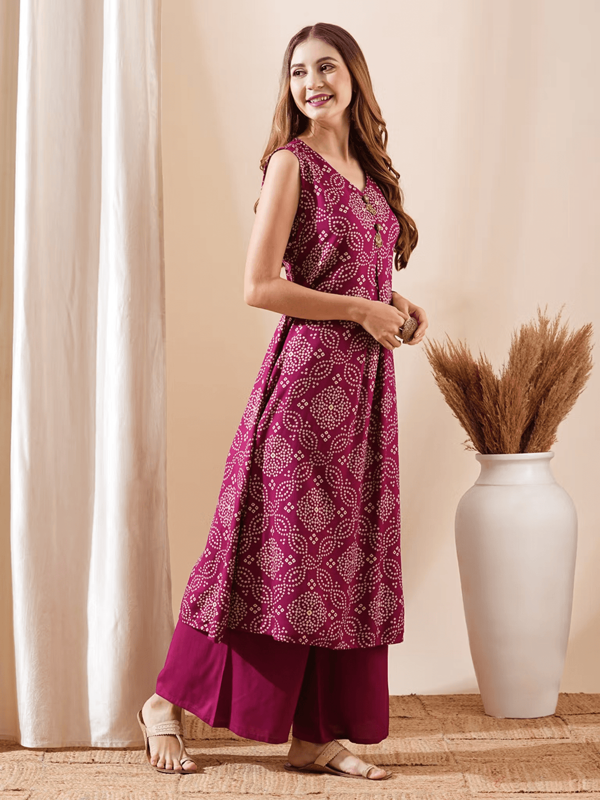 Elegant bandhani kurta set in magenta with intricate patterns and matching palazzo pants