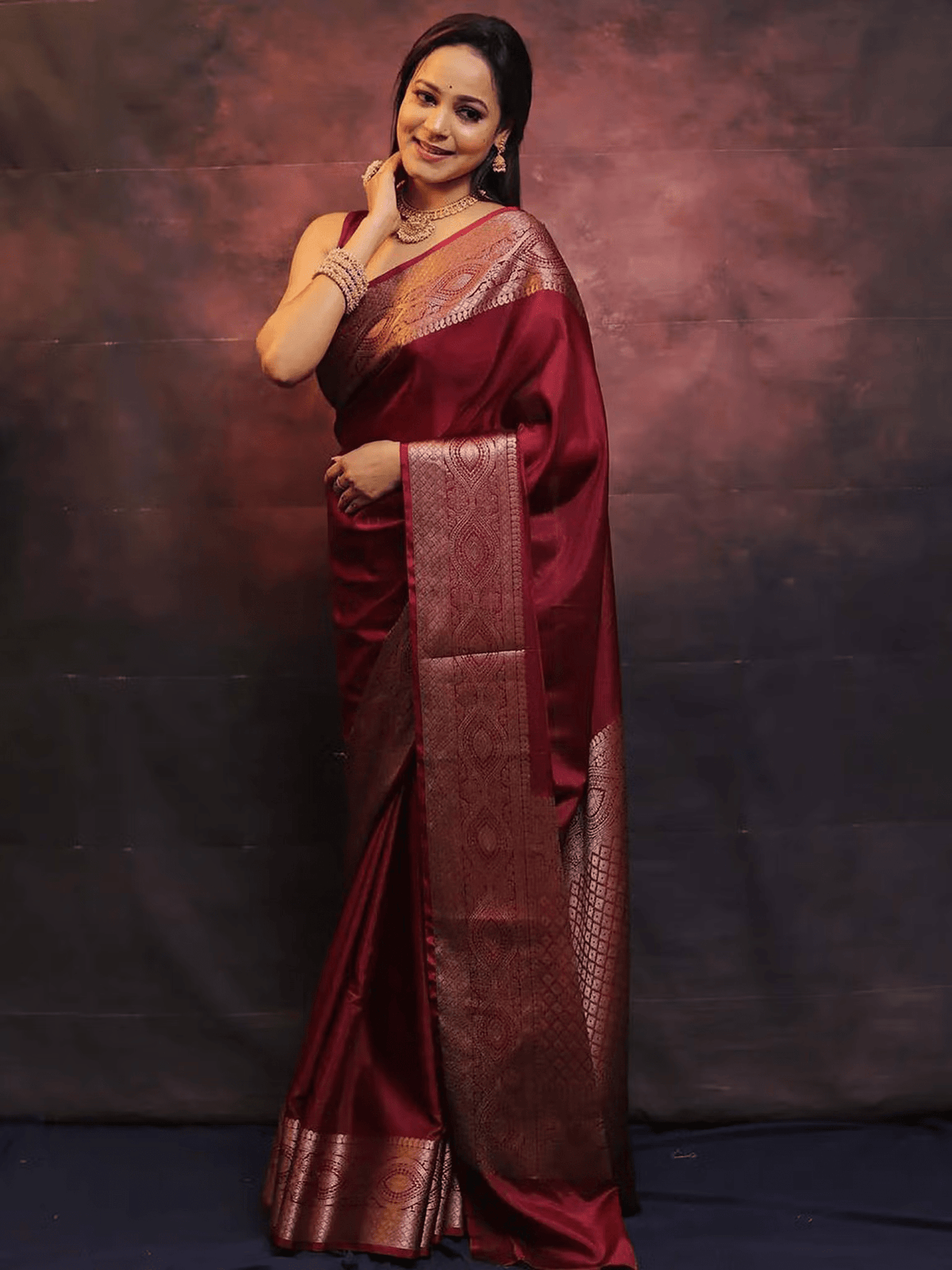Aromie elegant festive saree set in rich maroon with intricate gold border and traditional design