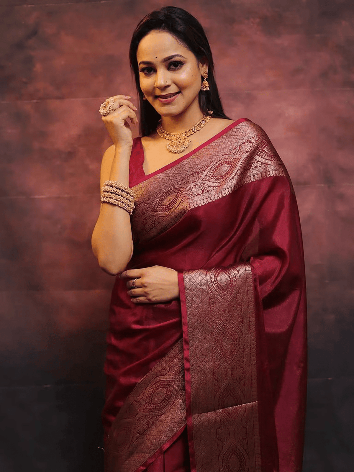 Aromie elegant festive saree set in maroon with intricate silver border worn by woman with jewelry