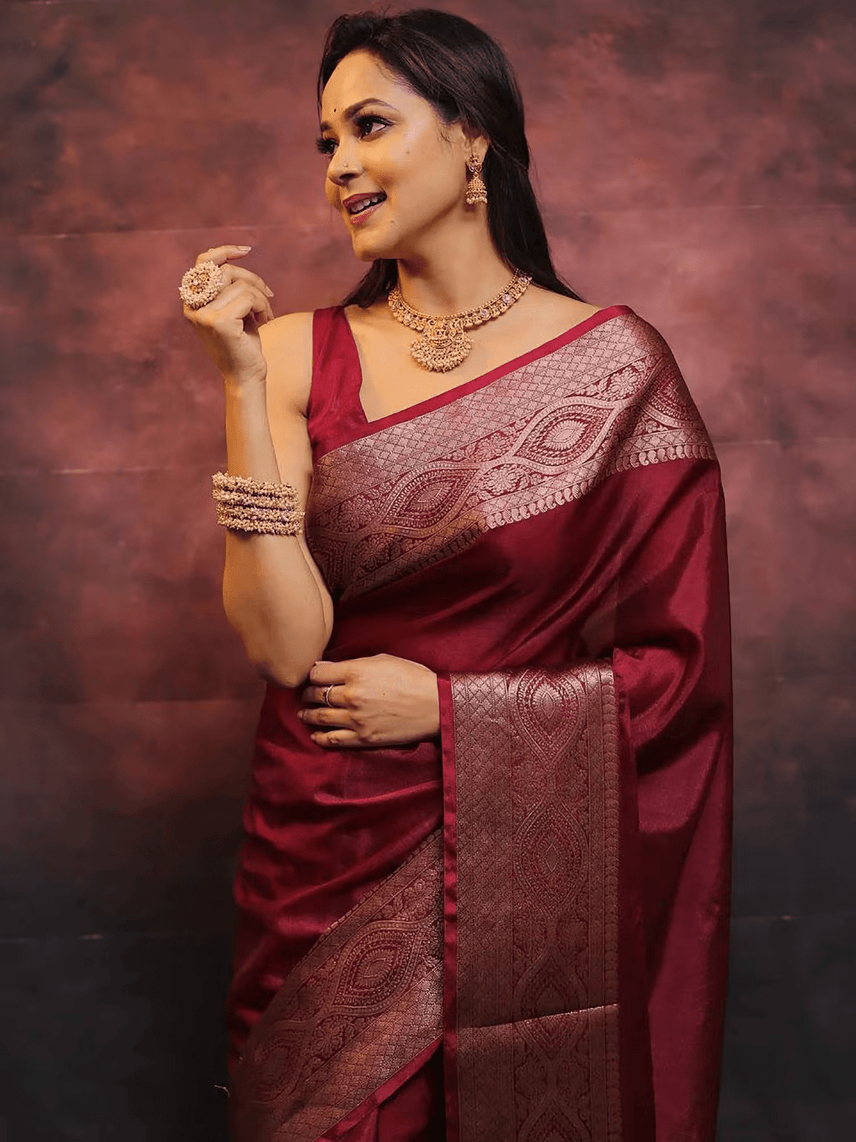 Aromie elegant festive saree set in deep maroon with intricate silver zari work and traditional jewelry