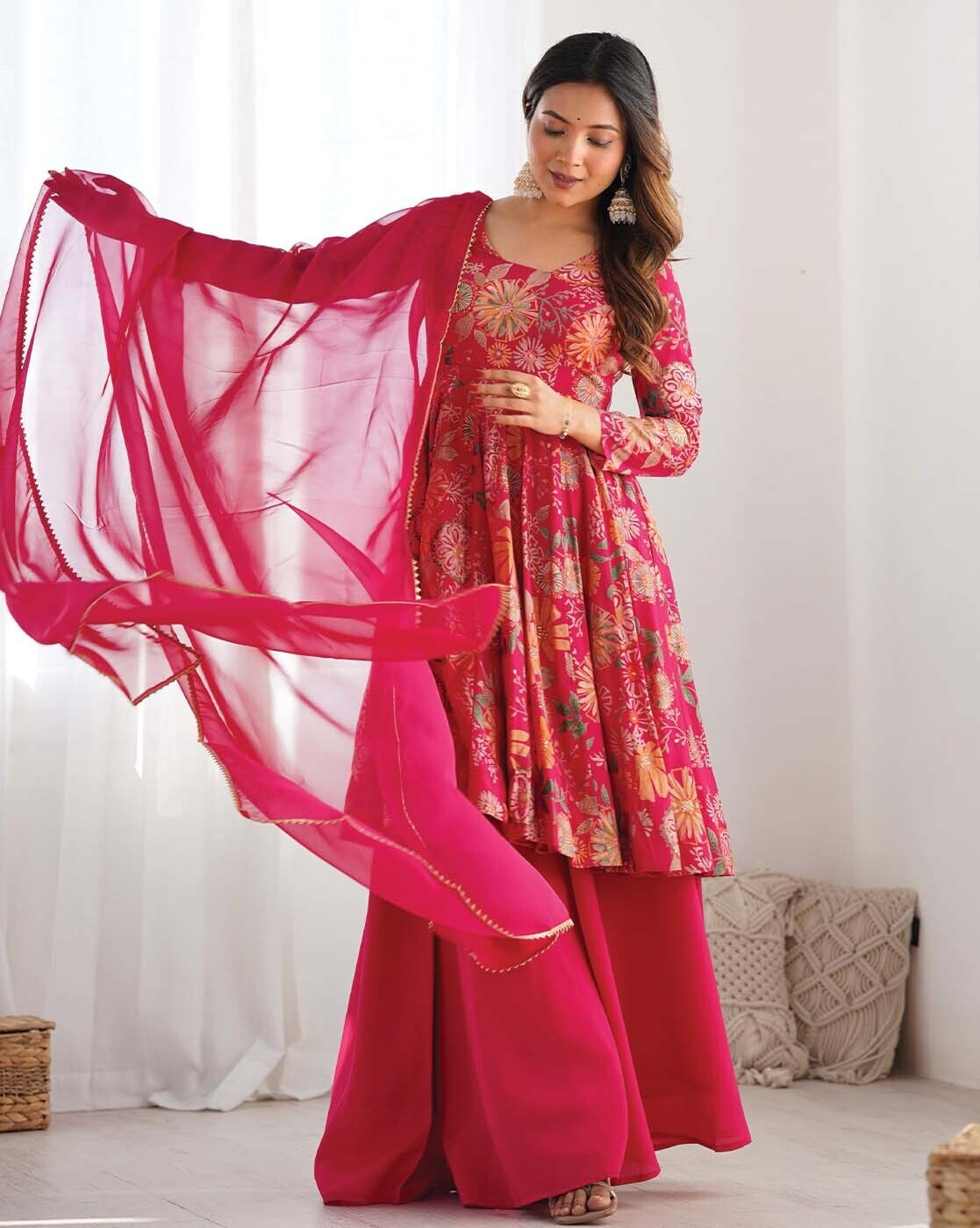 Elegant Indian kurta online featuring floral patterns and a flowing pink dupatta for stylish women