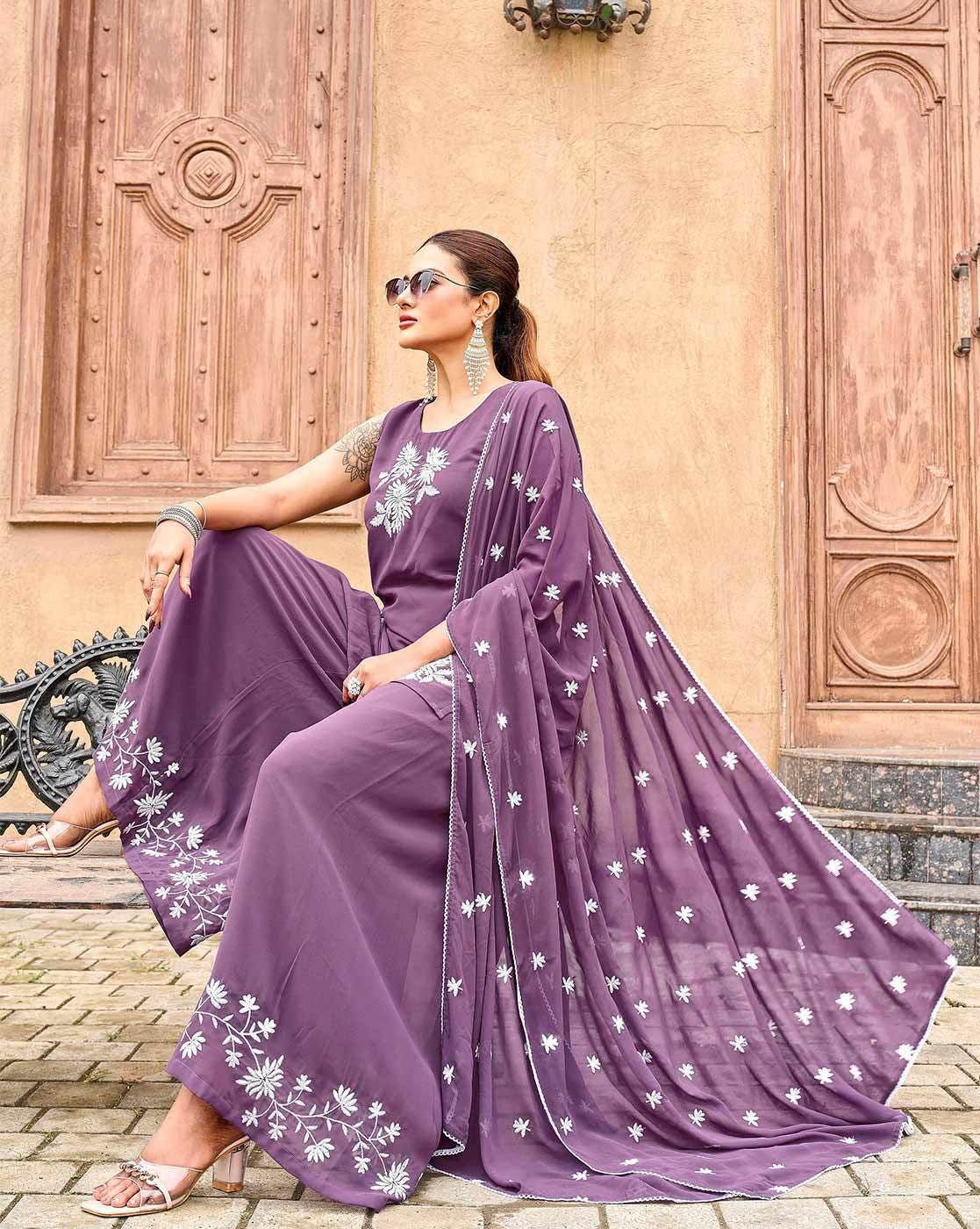 Elegant three piece kurta set in purple with floral embroidery, perfect for festive occasions and available online.