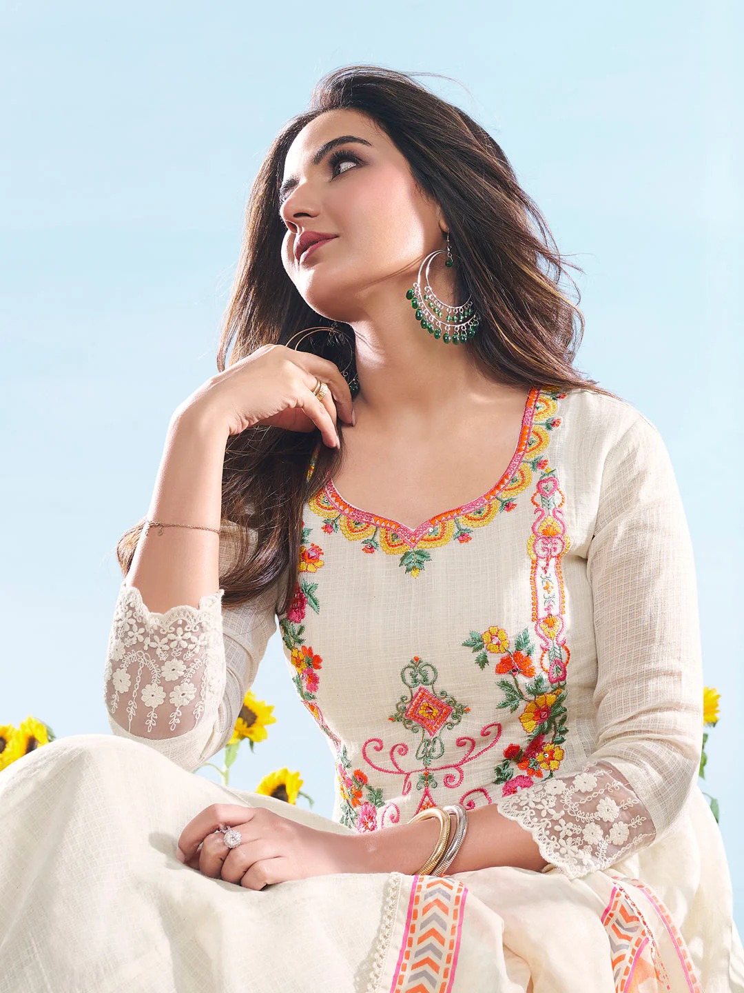 Elegant three piece kurta set in cream color with floral embroidery, perfect for festive occasions. Elegant kurta sets online USA.