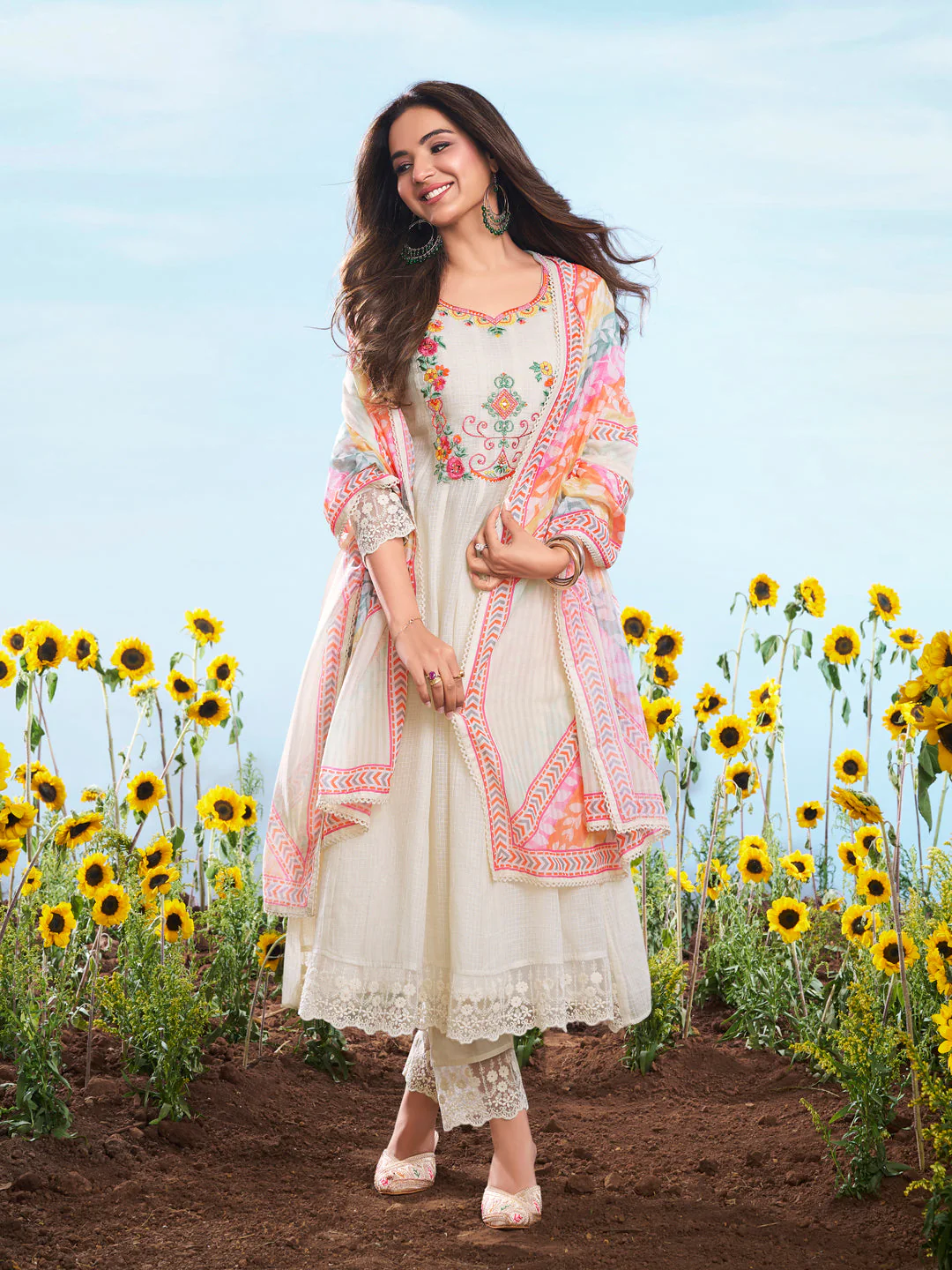 Elegant three piece kurta set in off-white with colorful embroidery, perfect for weddings, available online USA.