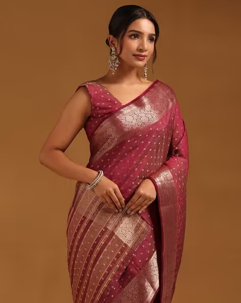 Front view of a burgundy georgette saree Canda with intricate golden border, perfect for festive occasions