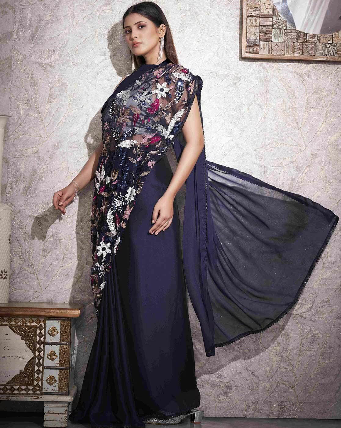 Elegant embellished saree with stones featuring floral designs and draped fabric for stylish occasions