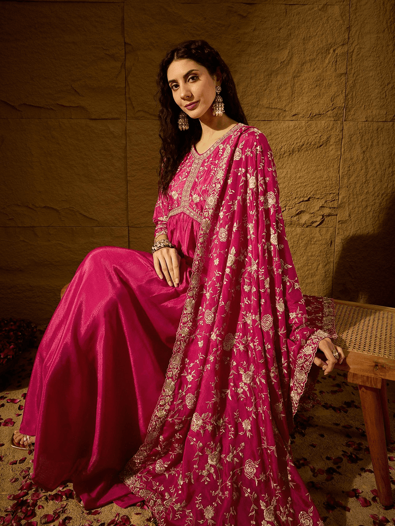 Pink embroidered anarkali gown with dupatta featuring intricate floral designs and a flowing silhouette