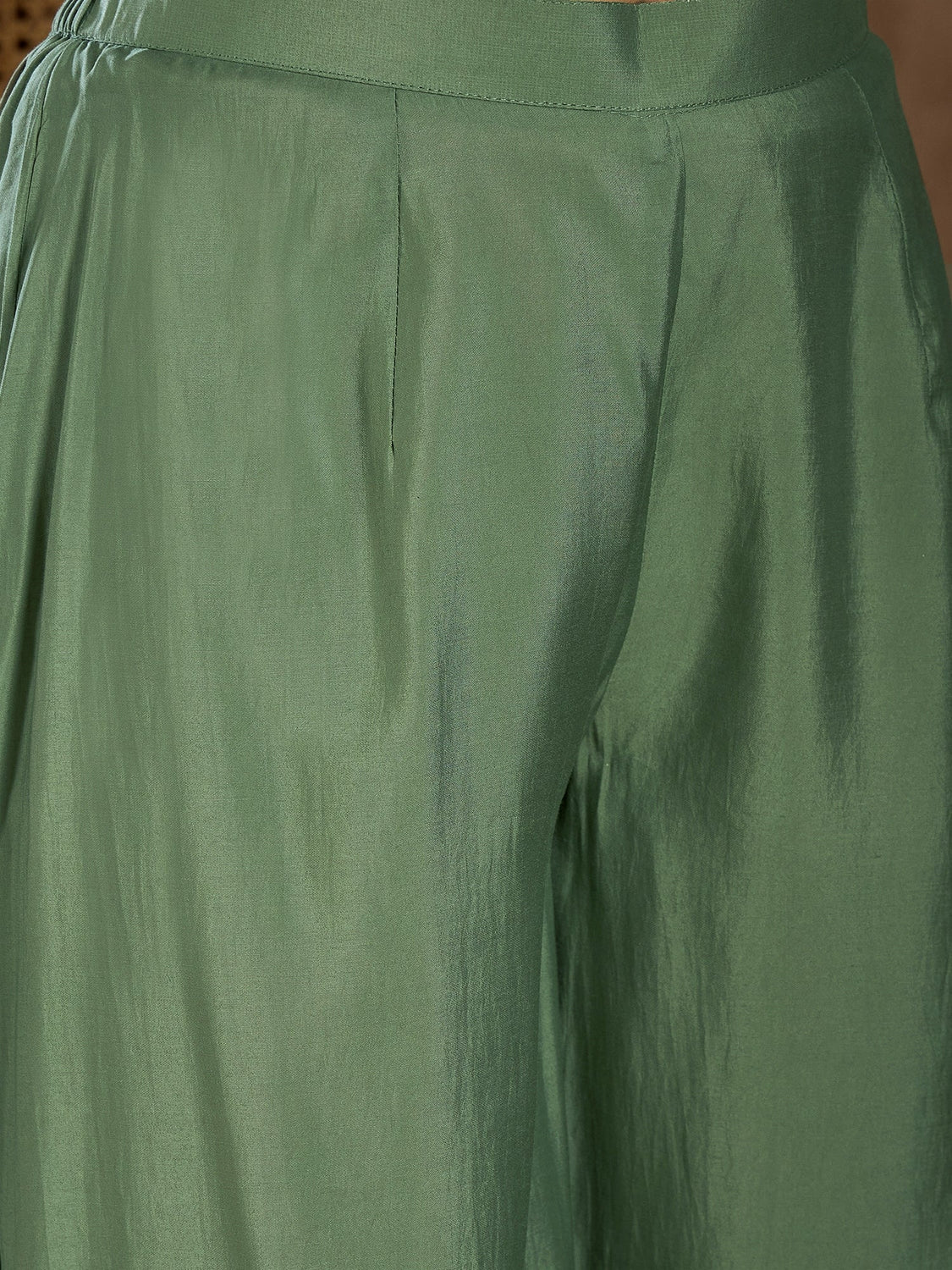 Detail view of a green three piece Embroidered Anarkali Kurta Canada made from soft fabric, ideal for festive occasions