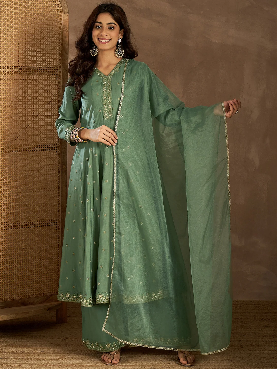 Green embroidered Anarkali Kurta from Aromie with detailed fabric, perfect for weddings in Canada