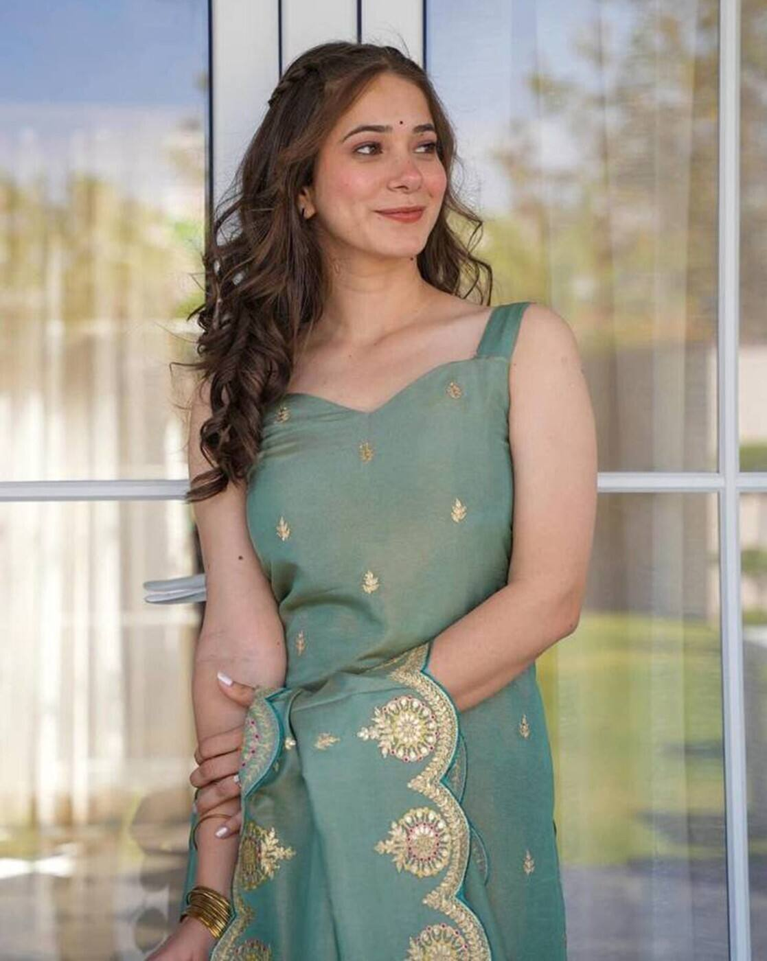 Aromie three piece embroidered Anarkali kurta set in green with gold detailing and matching dupatta