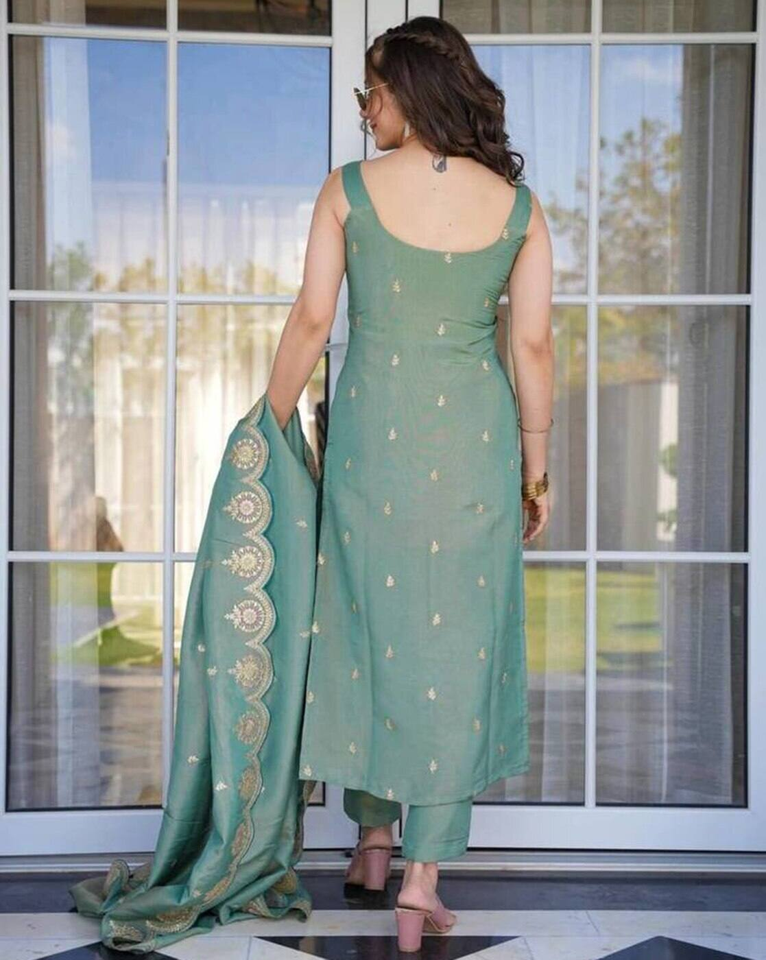 Aromie embroidered Anarkali kurta set in green featuring gold detailing and matching dupatta