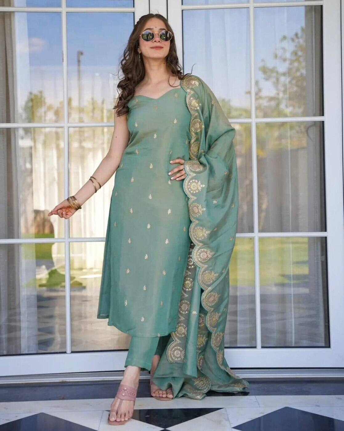 Aromie three piece embroidered Anarkali kurta set in pastel green with gold motifs and matching dupatta