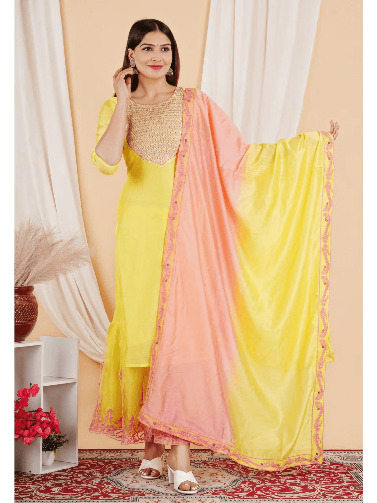 Aromie Embroidered Chanderi kurta set featuring a yellow kurta with a pink dupatta and intricate embroidery