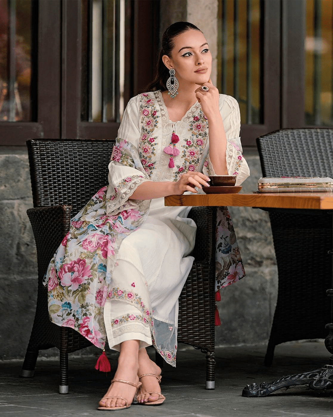 Elegant embroidered cotton kurta set with floral design and tassels, perfect for casual outings