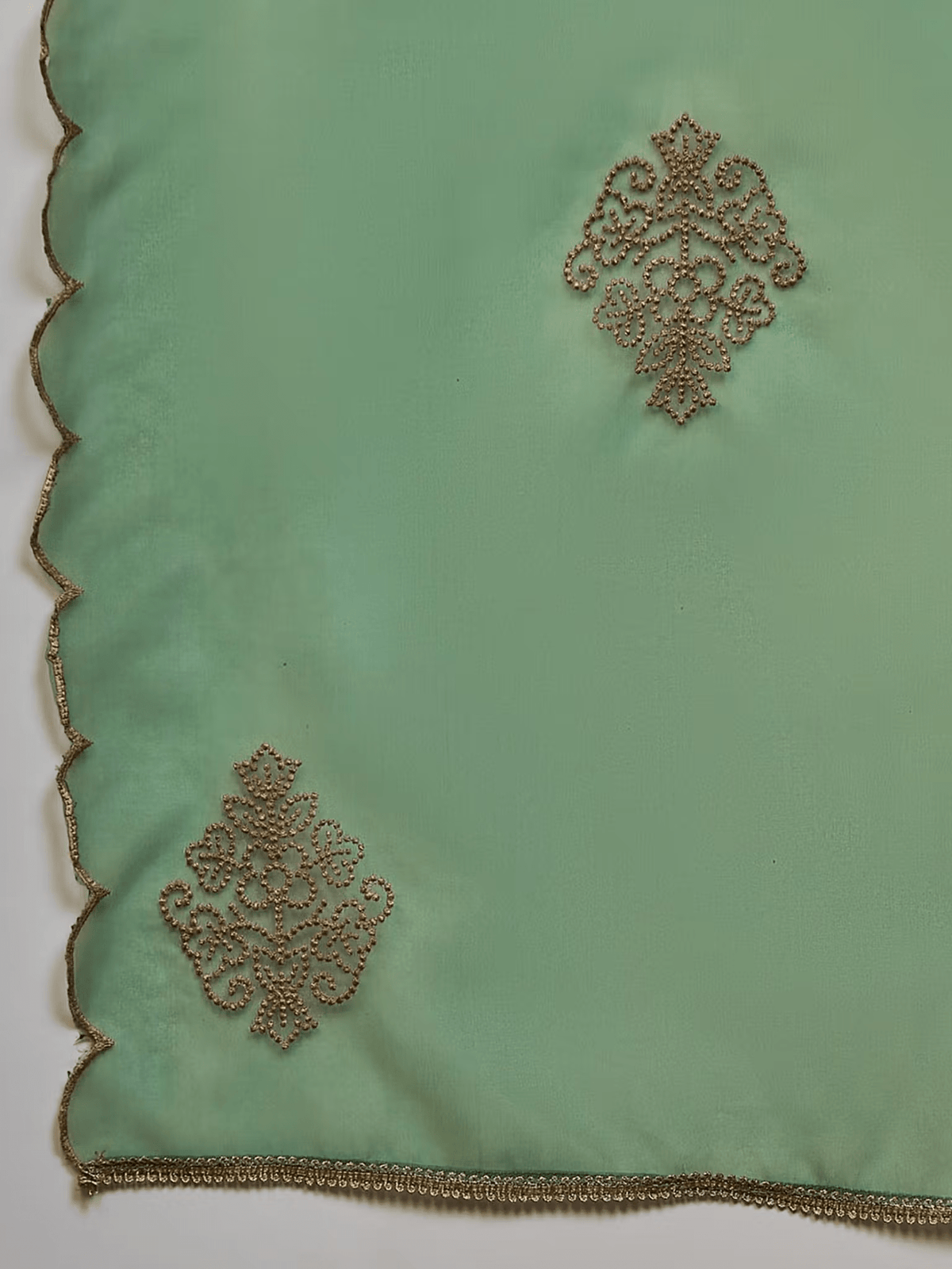 Embroidered dress set Canada in green with intricate gold detailing on the fabric edges