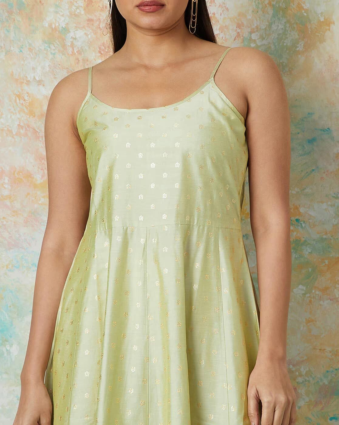 Light green embroidered flared kurta set with delicate gold accents for a trendy look