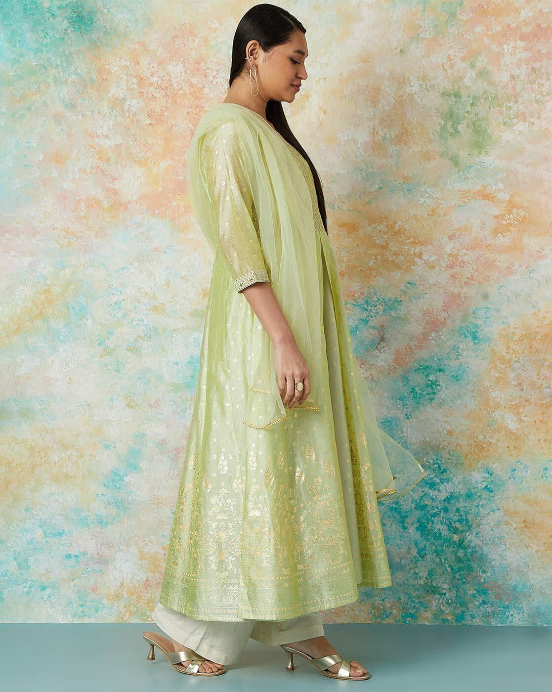 Embroidered flared kurta set in light green with a flowy silhouette and elegant embroidery details