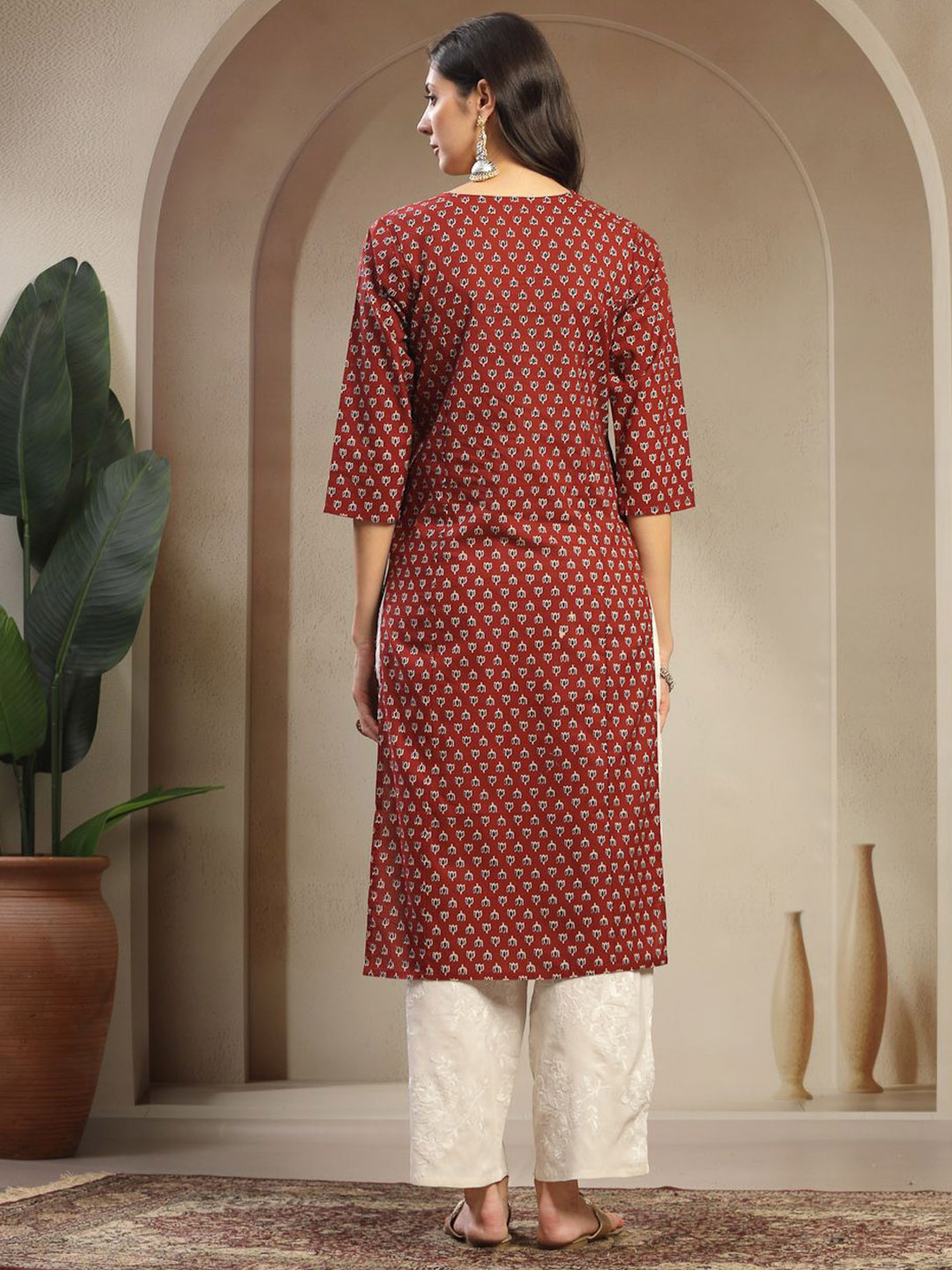 Aromie single piece kurta with intricate patterns styled as embroidered georgette jumpsuit from the back