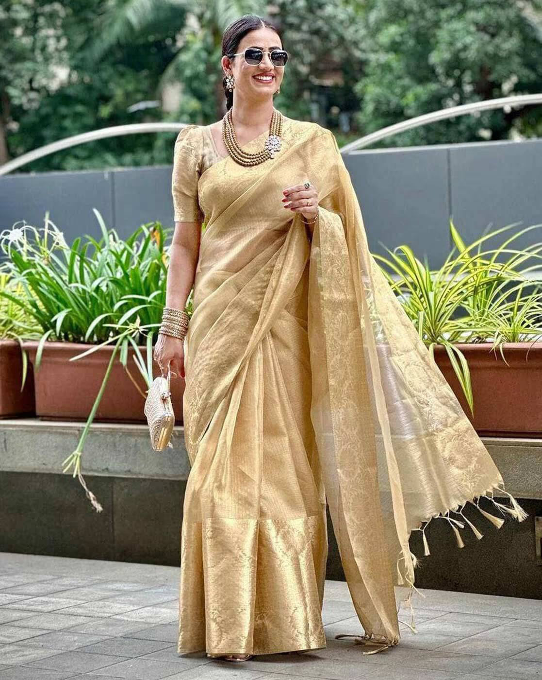Elegant Embroidered Gota Tissue Saree Canada in gold worn with stylish accessories